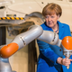 Image for article titled Why Is Angela Merkel Always Palling Around With Robots?